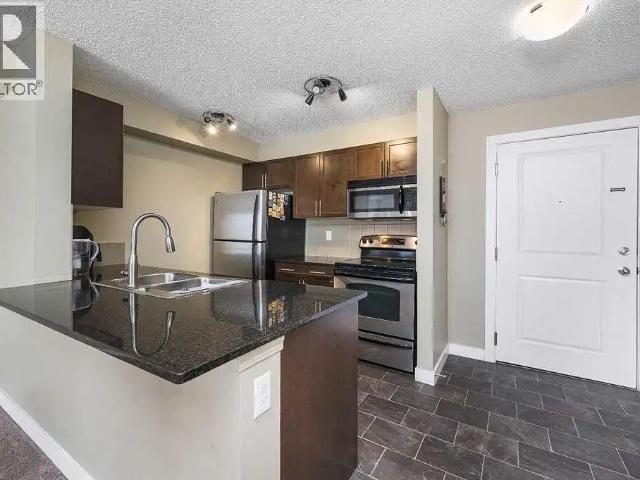 Bright 2 Bed, 2 Bath Condo with Balcony & Underground Parking, Glenbow Cochra