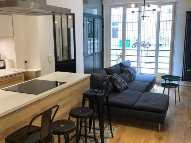 Bright apartment looking out onto the building's private courtyard separate bedroom close La Défense with quick access to central Paris