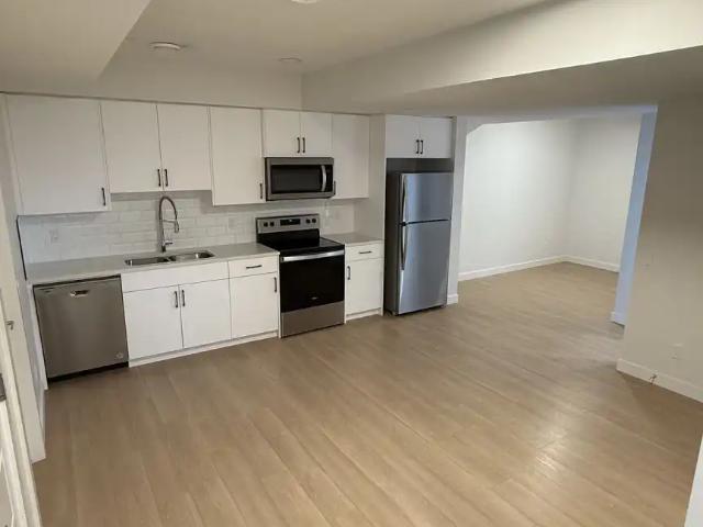 Bright Modern Basement Suite Utilities Included | Backing to Pond