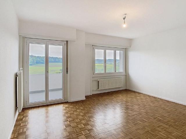 Bright, through house apartment with stunning views and two balconies!