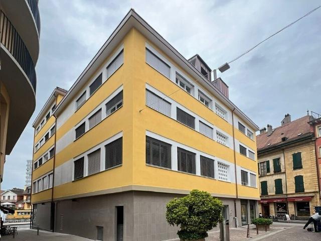 building ideally located in the city center of YVERDON, close to all shops