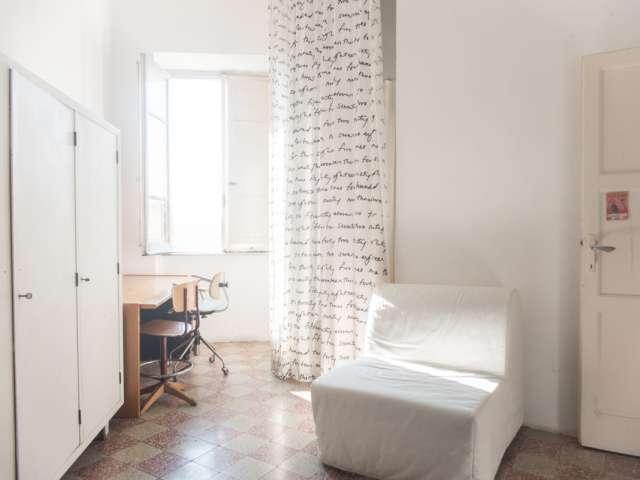 Camera arredata in appartamento con 2 camere da letto a Ostiense, Roma