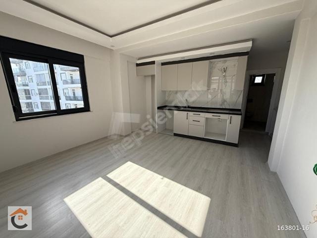 CAPİTOL'DEN FİNİKE'DE ANA YOL VE DENİZE YAKIN SATILIK 1+1 DAİRE