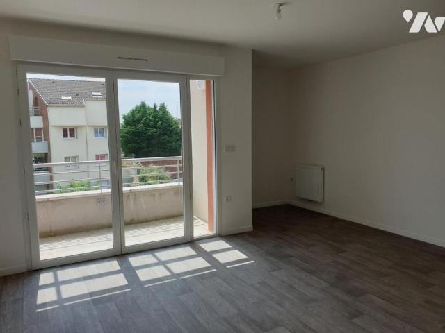 CARVIN: centre ville résidence neuve T3 avec balcon et garage à 625 euros