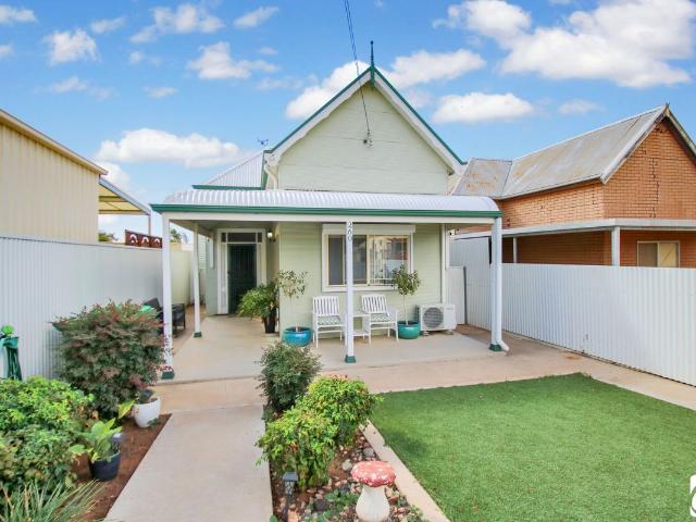 CENTRAL COTTAGE WITH RENTAL APPEAL AND HISTORIC CHARM