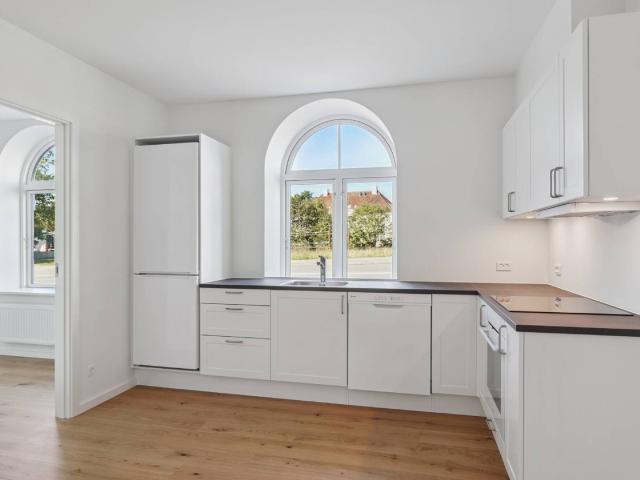 Centralt lejemål med depot og fælles vaskeri