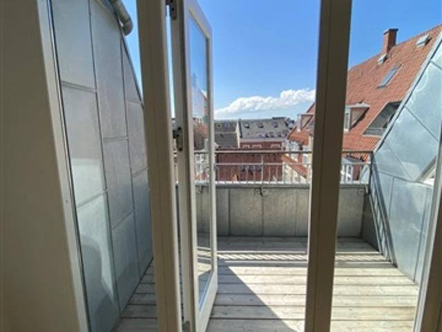 Charmerende taglejlighed i hjertet af Aalborg