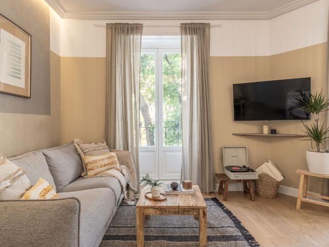 Charming 1 Bedroom Apartment with Four Balconies and Geometric Wood Design in Almagro, Madrid Amsterdam Apartments for Rent