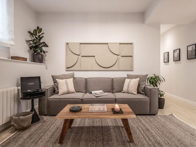 Chic 3 Bedroom Apartment with Beach Inspired Design, Terrace, and Doorman in Almagro, Madrid Amsterdam Apartments for Rent