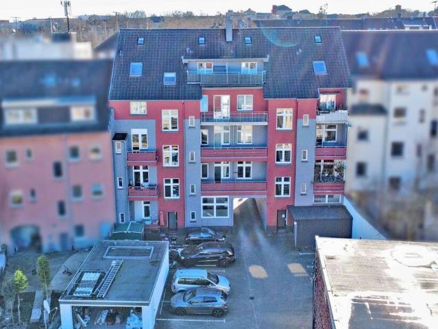 Citynahes Mehrfamilienhaus mit Gewerbeeinheit im Hof