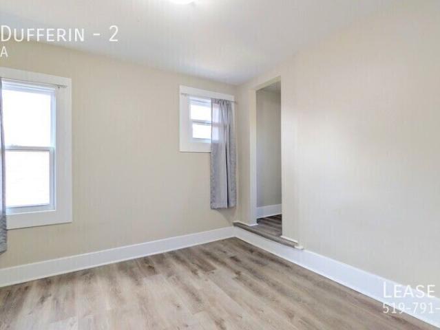 Completely Renovated 2 Bed, 1 Office and 1 Bathroom Upper Unit in Downtown Windsor