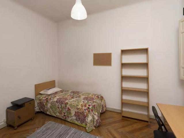 Cozy room with window view interior patio in shared apartment, Chamberí