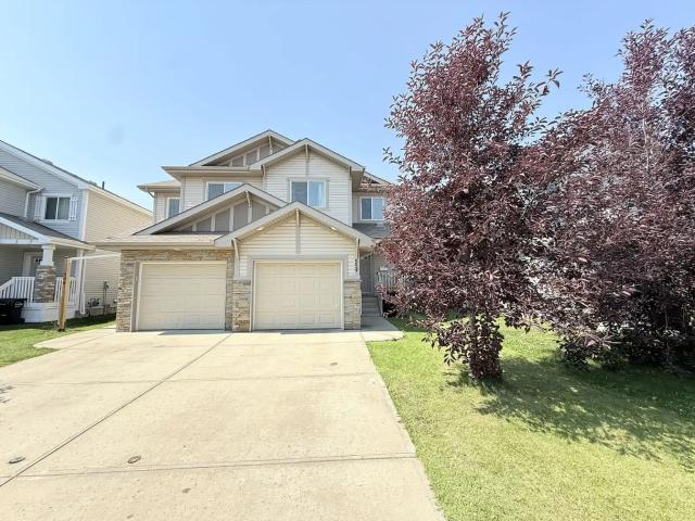 Cozy three bedroom duplex with AC and fenced backyard: SW Edmonton