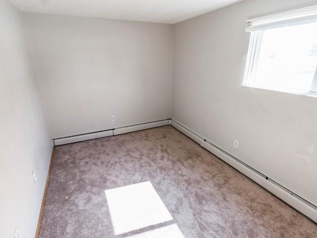 COZY 2 BED/1 BATH LOWER UNIT ACROSS FROM GOLF COURSE AT A GREAT PRICE! 2 Bedroom Apartment for Rent at 5, Cochrane, AB T4C None