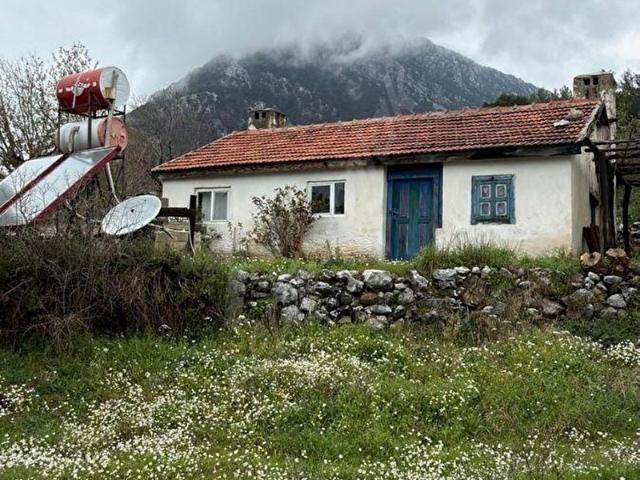 DALAMAN ÇÖĞMEN SATILIK YATIRIMLIK İÇERİSİNDE EV BULUNAN TARLA