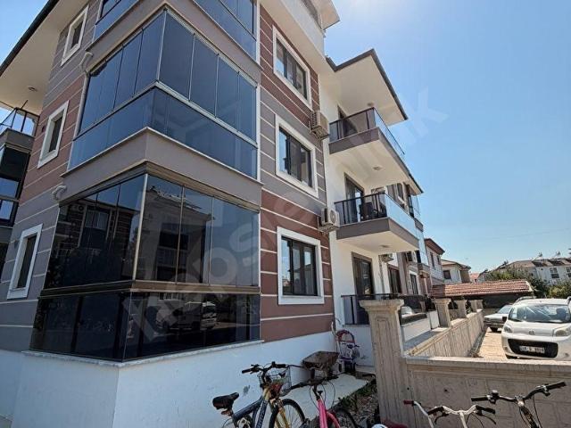 DALAMAN HÜRRİYET MEVKİ'NDE OTOPARKLI VE CAM BALKONLU 2+1 KİRALIK