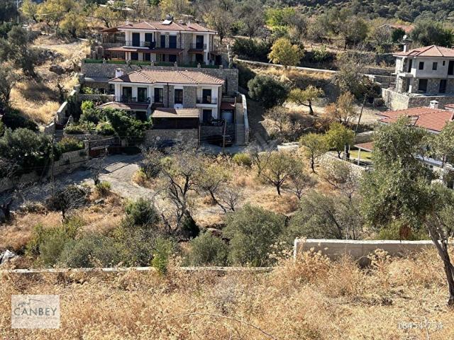 Datça Mesudiye'de deniz manzaralı köyiçi %40 imarlı 1018 m2 arsa
