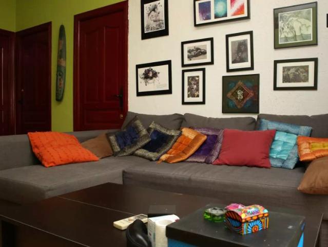 Decorated room with chest of drawers in shared apartment, Triana