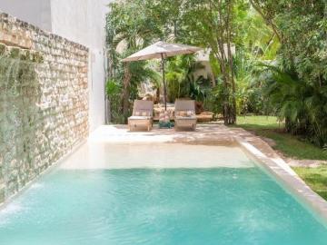 Departamento en venta 1 recamara en planta baja con jardín en Aldea Zama