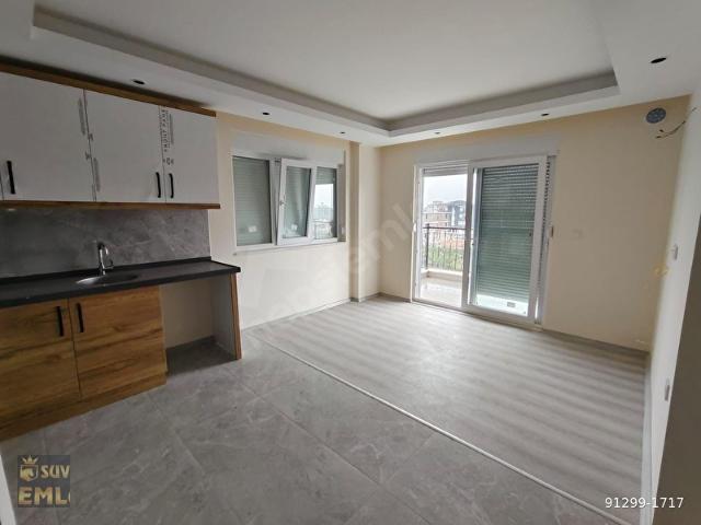 DÖŞEMEALTINDA MERKEZİ KONUMDA 1+1 KATDA SIFIR KİRALIK DAİRE