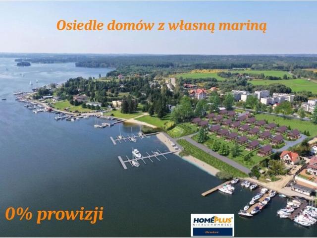 Dom nad Jeziorem Ryńskim z tarasem i miejscem na łódź
