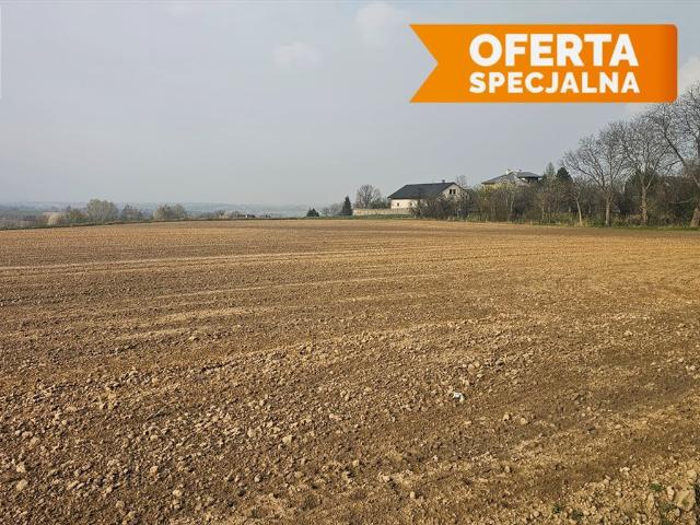 Działka budowlana 1200 m² z mediami, widokowa, asfalt