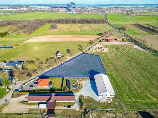 Działka inwestycyjna 7635 m² z MPZP, media, 134 m frontu