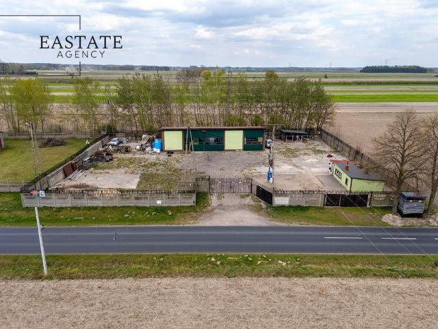 Działka przemysłowa 2400 m² z halą i dostępem do drogi asfaltowej