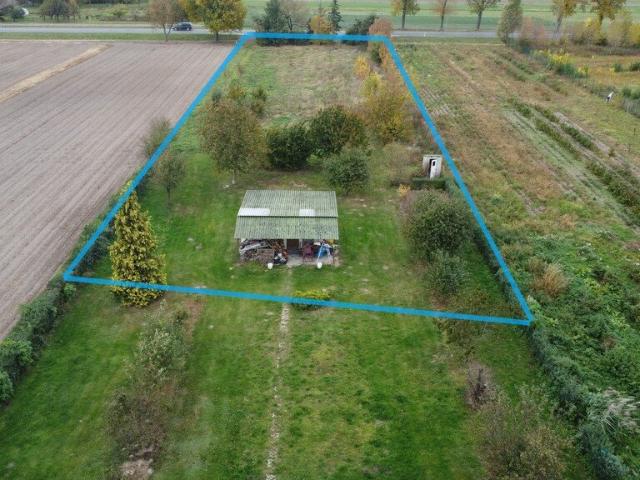 Działka 0,40 ha z budynkiem i dostępem do DK 12
