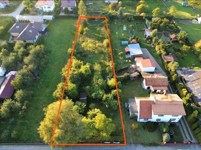 Działka 1736 m² z warunkami zabudowy, ogrodzona, blisko jeziora