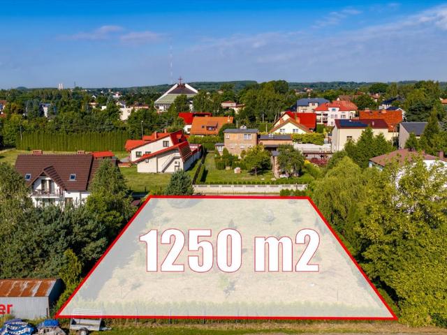 Działka 1250 m² z mediami i nowoczesną zabudową