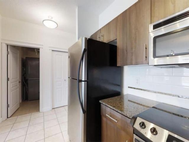 Edmonton Unfurnished Condo Rental in Downtown Executive Fourth Floor Unit Across MacEwan With 2 Parking Stalls!