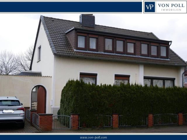 Ein /Zweifamilienhaus in ruhiger Siedlungslage mit schönem Garten