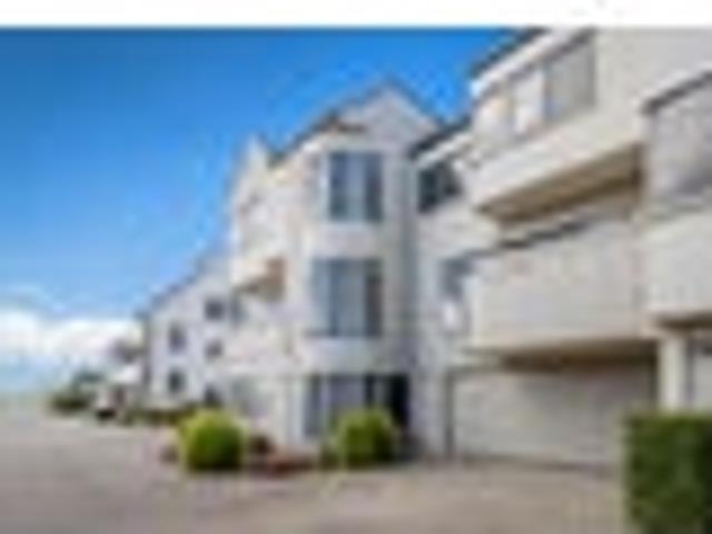 Elevated across three levels of beachside living