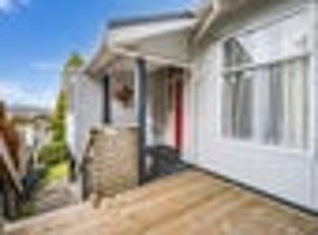 Elevated Home with Sunroom & Charm