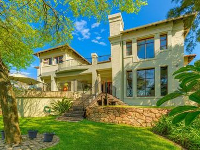 elegant riverside retreat with 5 en.