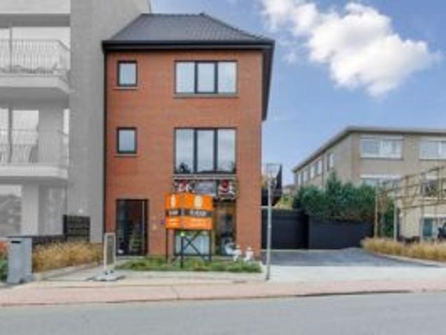Energiezuinige woning met handelsruimte op toplocatie
