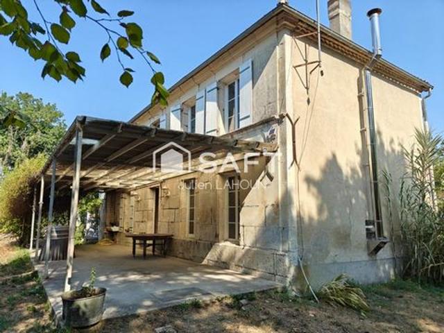 Ensemble immobilier avec deux maisons et terrain