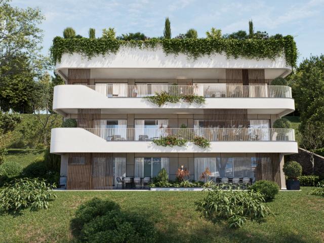 ESCLUSIVO 3.5 LOCALI CON VISTA LAGO GIARDINO E FINITURE