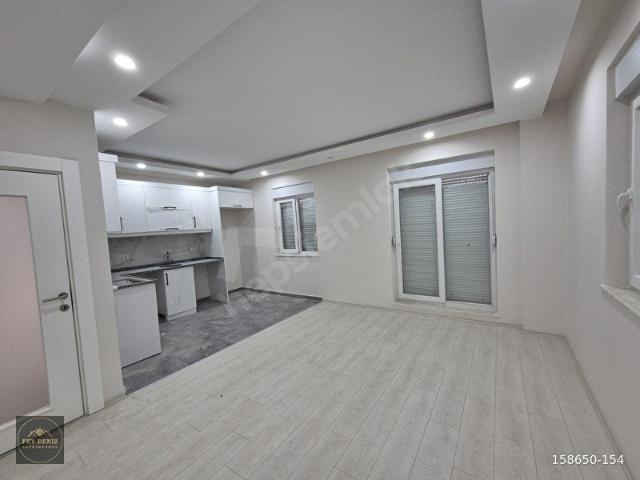 ERENKÖY'DE AÇIK MUTFAKLI SIFIR KULLANIŞLI GİRİŞ KAT 2+1 DAİRE