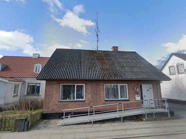 Et plans gulstens hus i Tolne