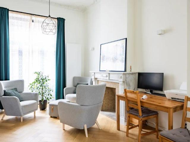 Exclusief triplexappartement met 4 slaapkamers in gerenoveerde herenwoning