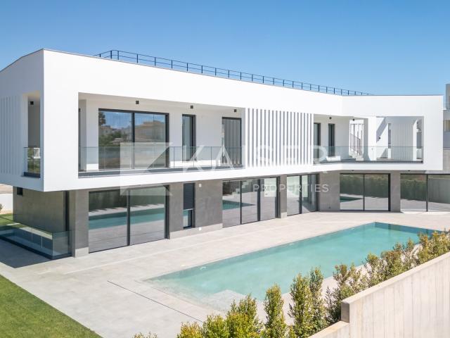 Exclusiva moradia moderna de 4 3+1 quartos em construção com piscina aquecida, vista mar, perto da praia e do golfe