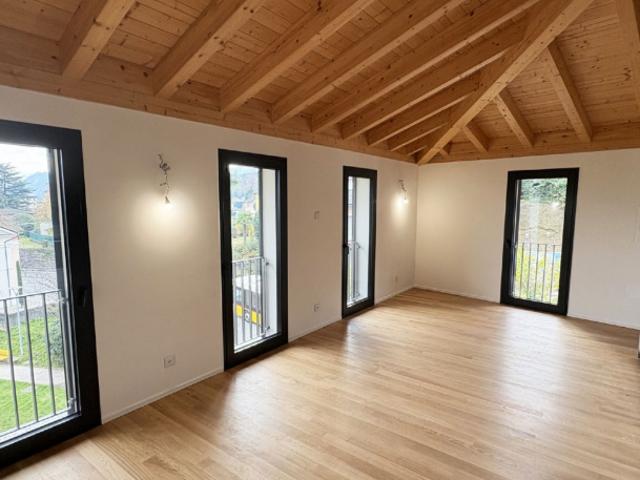 Exklusives Penthouse mit Seeblick in Pura Moderner Komfort in idyllischer Lage