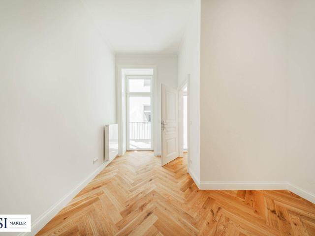 Exquisite Wohnqualität: Frisch sanierter Altbau mit sonnigem Balkon