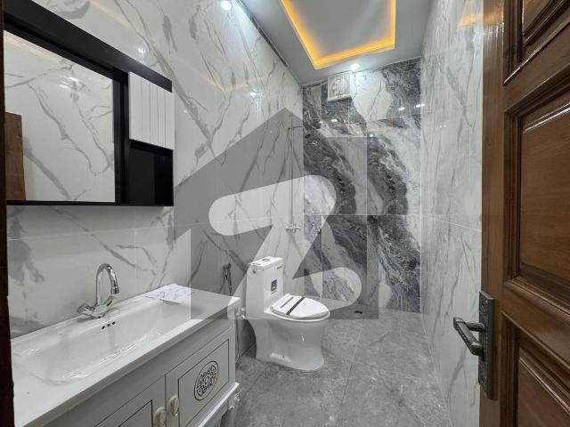 F 10 excellent house top location modern fitting and fixtures beautiful green lawn house for rent f 10