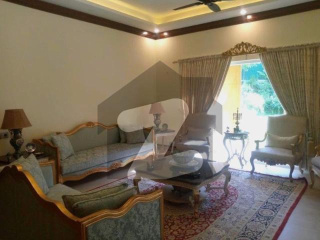 F7 House Available For Rent Plot Size Is 666 Sq Yds With 1200 Sq Yds Of Additional Landscaped And Fenced Lawn, With Pines, Water Fall, Bonfire And BBQ Area. F 7
