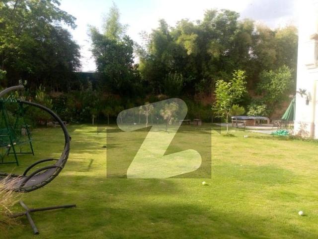 F7 House For Rent Plot Size Is 666 Sq Yds With 1200 Sq Yds Of Additional Landscaped And Fenced Lawn, With Pines, Waterfall, Bonfire And BBQ Area
