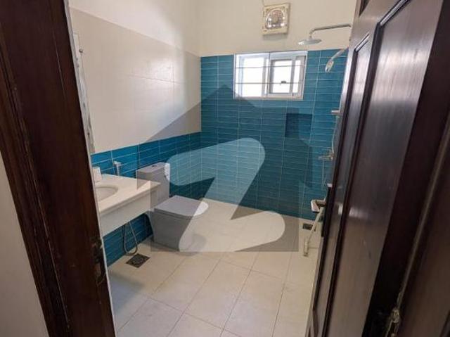 F 10 Excellent 1 Kanal House Double Storey House, Spacious Rooms Proper 5 Bedrooms, 5 Attached Bathrooms Modern Fittings Along With Tile Flooring Drawing Dining, TV Lounge, Kitchen, Beautiful Lawn F 10