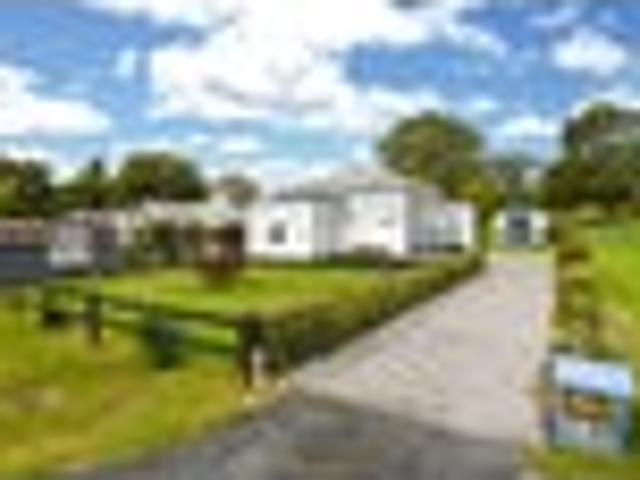 Family home with cabins, large garage and gardens!